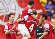 Arsenal 3-1 Stoke City: Ozil sets up Gunners treble
