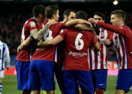 Atletico ease past Sociedad, cut Barcelona's lead