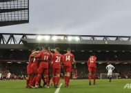 Rampant Liverpool go top with six of the best