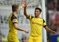 Dortmund crush Freiburg to stay on Bayern's heels